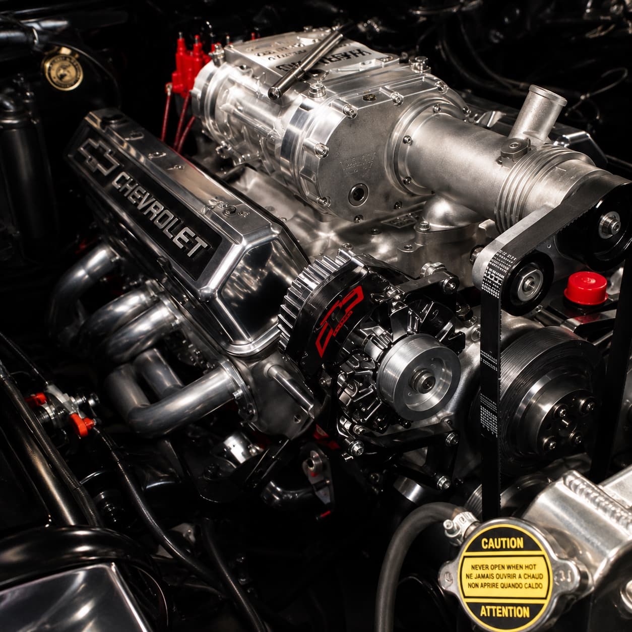 Studio-lit chrome-dressed supercharged small-block